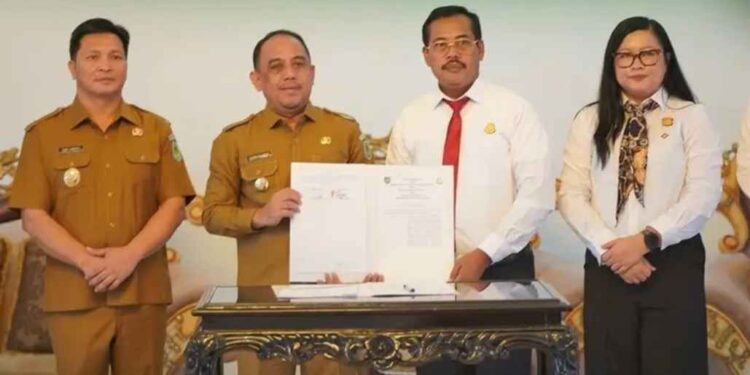 Pemkab Bolmong Bersama Kejari Kotamobagu Teken MoU  Penanganan Perdata Dan TUN