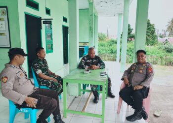 Kapolsek Posigadan Perkuat Sinergitas dengan Koramil 1303-17 melalui Silaturahmi